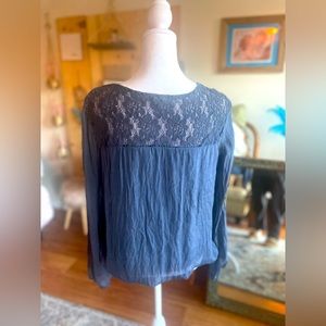 100% Italian silk blouse with lace.